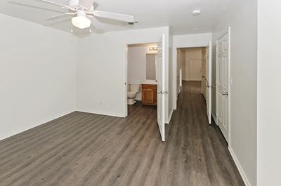 Bedroom with attached bathroom at Cypress View Villas in Weatherford TX